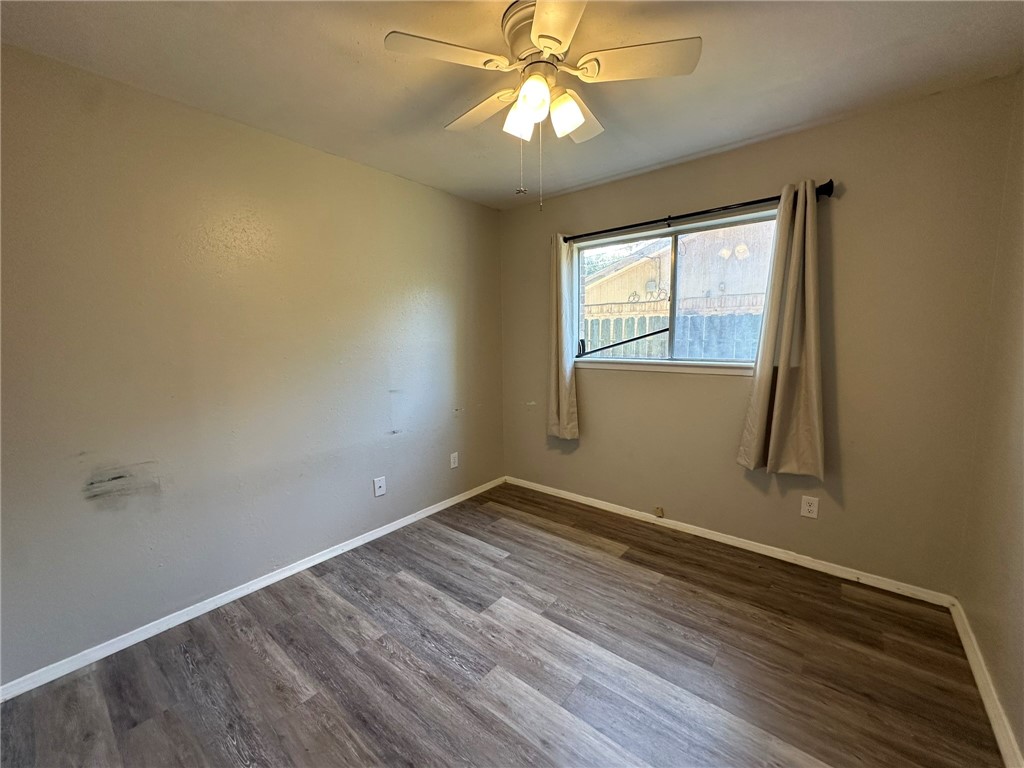 2994 Lovers Lane Ingleside, TX 78362 - Photo 20 of 39 an empty room with a window and wooden floor