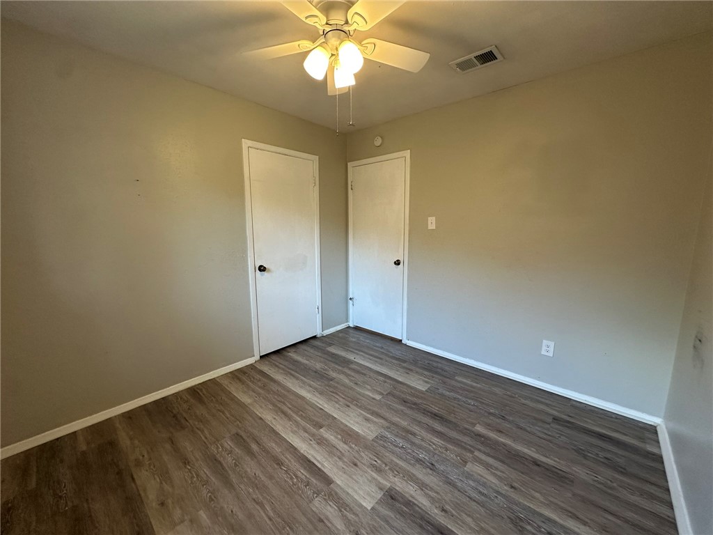 2994 Lovers Lane Ingleside, TX 78362 - Photo 21 of 39 a view of an empty room with wooden floor and a window