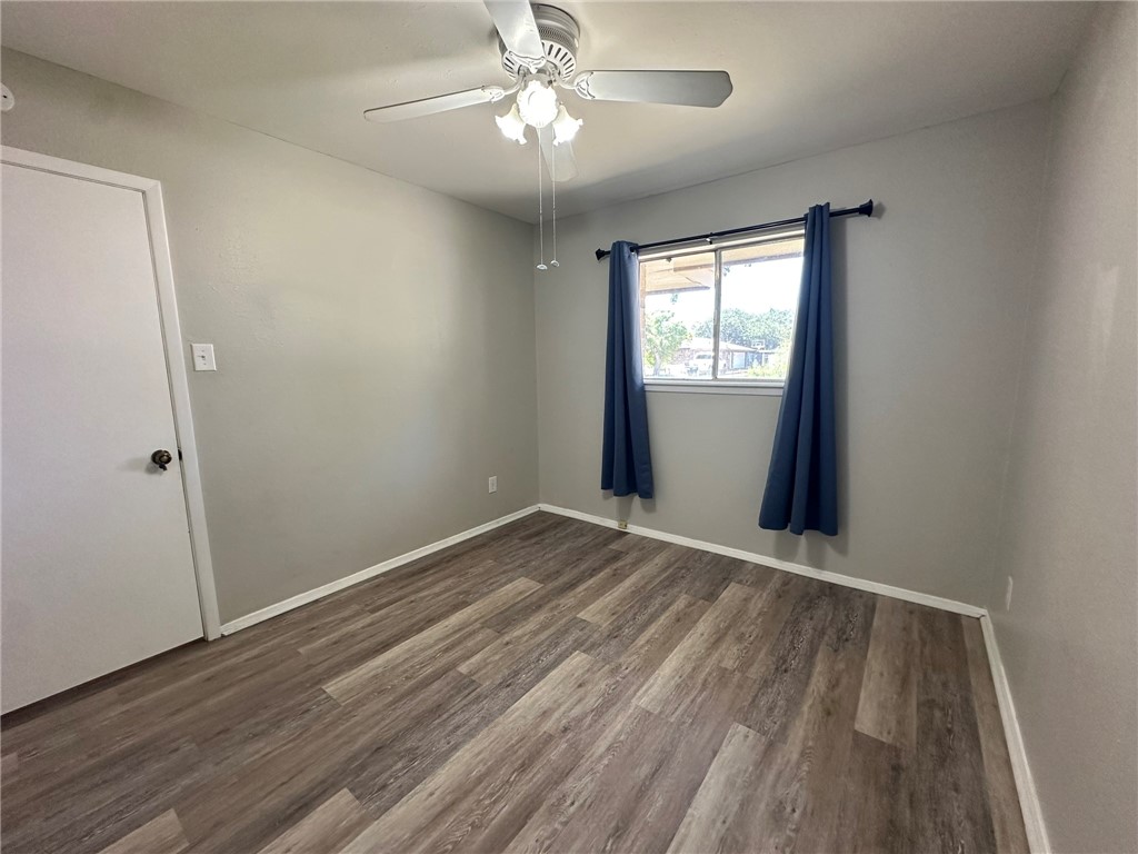 2994 Lovers Lane Ingleside, TX 78362 - Photo 27 of 39 a view of an empty room with wooden floor and a window