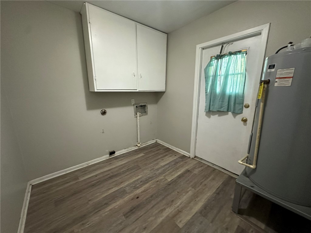 2994 Lovers Lane Ingleside, TX 78362 - Photo 28 of 39 an empty room with wooden floor and mirror