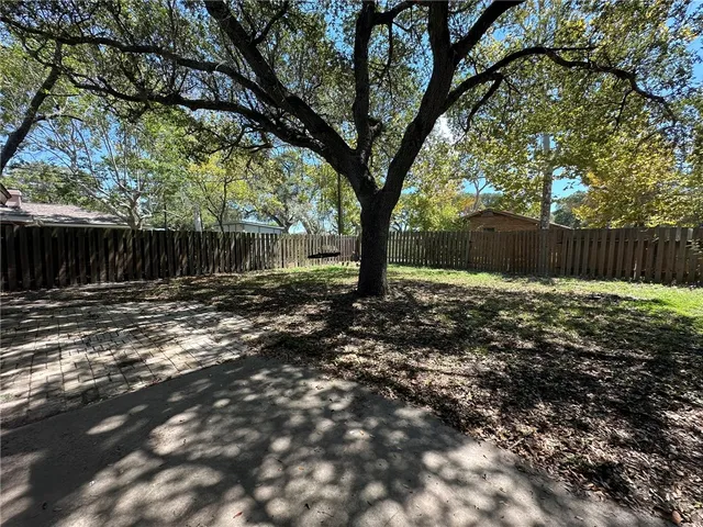 a backyard of a house with lots of green space