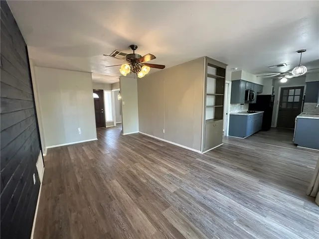 a view of a kitchen with a sink and a kitchen view