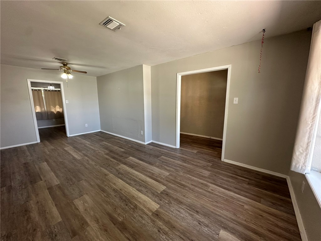 2994 Lovers Lane Ingleside, TX 78362 - Photo 6 of 39 wooden floor in an empty room with a window