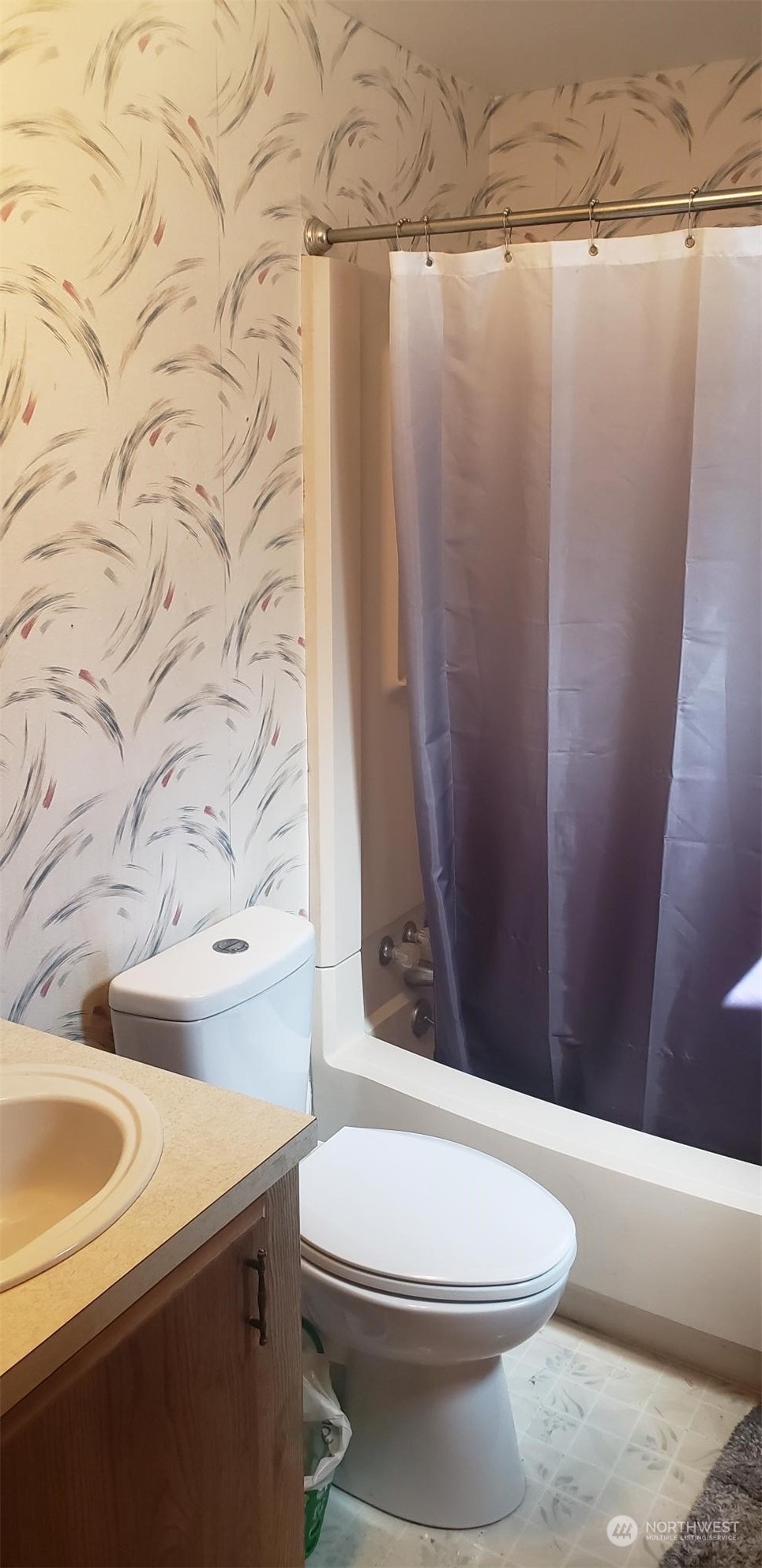 15291 Maple Drive, Unit M91 Renton, WA 98058 - Photo 5 of 12 a bathroom with a sink a toilet and shower