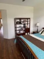 a room with wooden floor and windows