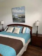 a bedroom with a bed and a night stand