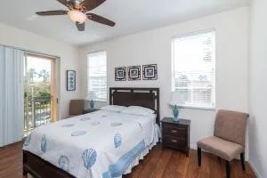 a bed sitting in a bedroom next to a window