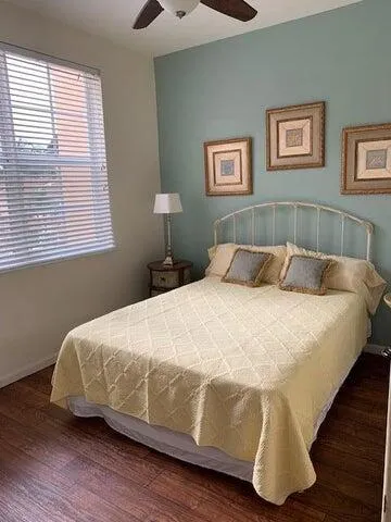 a bedroom with a bed and a night stand