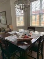 a view of a dining room with furniture and window