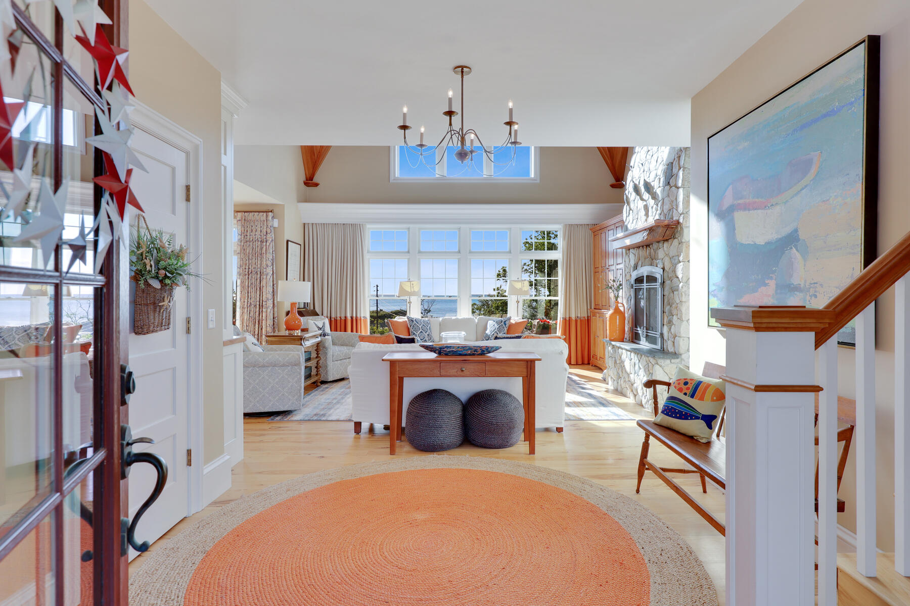 345 Robbins Hill Road Brewster, MA 02631 - Photo 31 of 95 a living room with furniture a fireplace and a chandelier