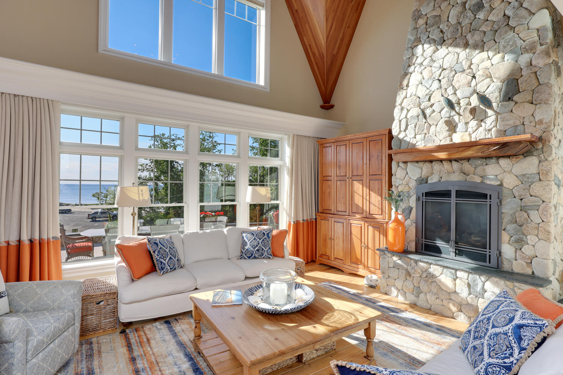 345 Robbins Hill Road Brewster, MA 02631 - Photo 35 of 95 a living room with furniture and a large window