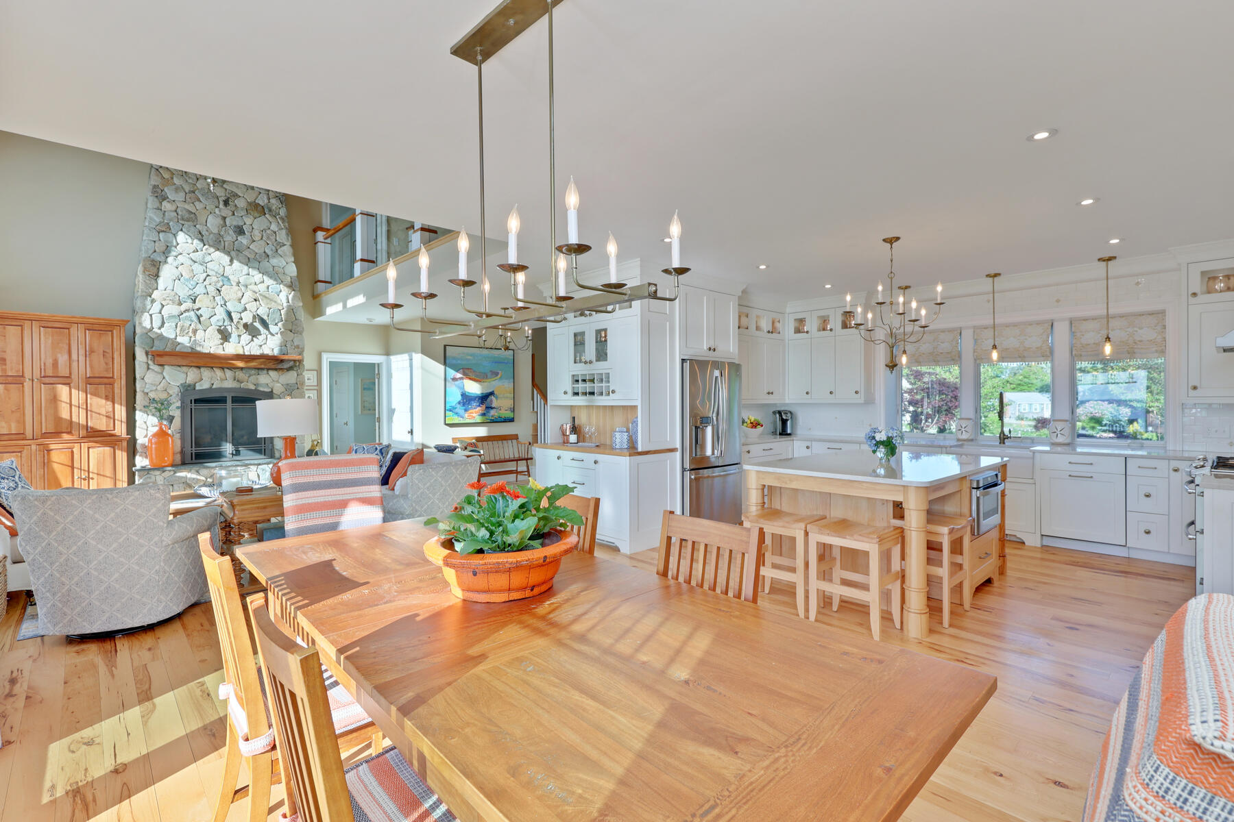 345 Robbins Hill Road Brewster, MA 02631 - Photo 41 of 95 a view of a dining room with furniture a chandelier and wooden floor