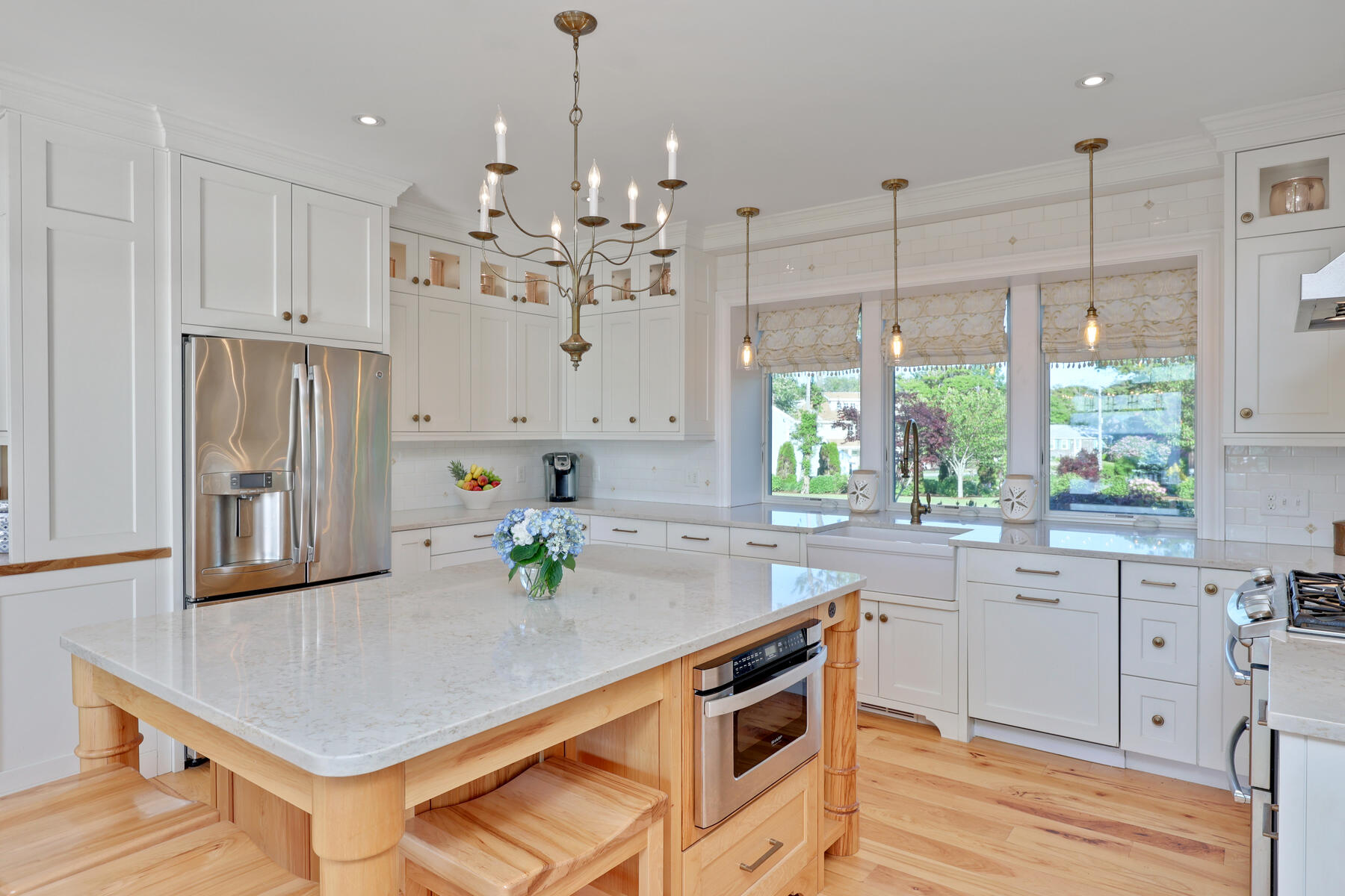 345 Robbins Hill Road Brewster, MA 02631 - Photo 42 of 95 a kitchen with stainless steel appliances granite countertop a sink a stove and a refrigerator