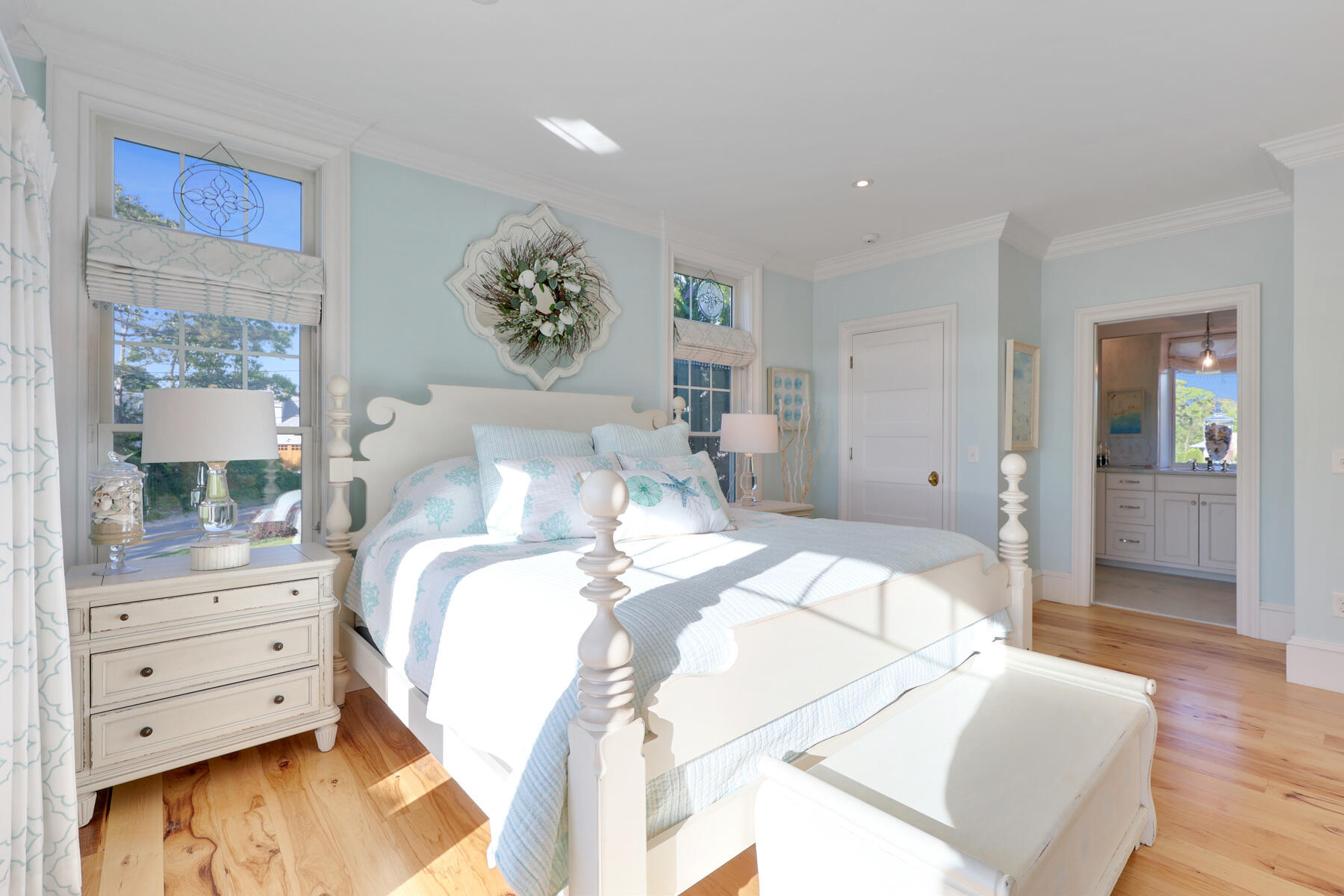 345 Robbins Hill Road Brewster, MA 02631 - Photo 54 of 95 a bedroom with a bed and a painting on the wall