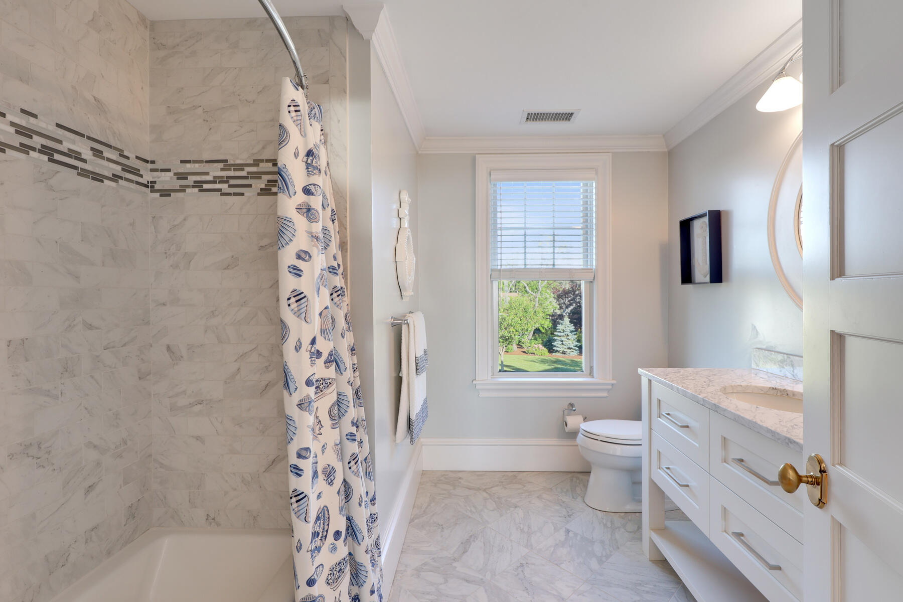 345 Robbins Hill Road Brewster, MA 02631 - Photo 69 of 95 a bathroom with a bathtub sink vanity mirror and toilet