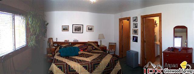 650 Moki Avenue Rifle, CO 81650 - Photo 4 of 4 a bedroom with furniture and a window