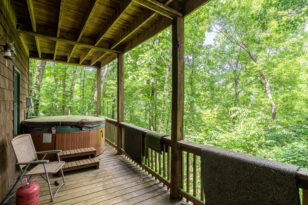124 Adair Drive Ranger, GA 30734 - Photo 20 of 25 a view of balcony with wooden floor and outdoor seating