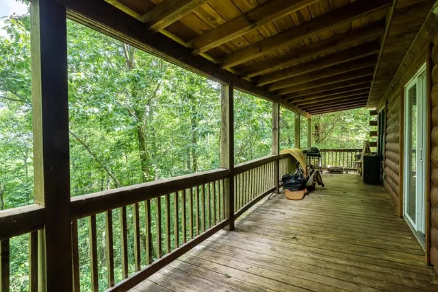 a view of a balcony with wooden floor