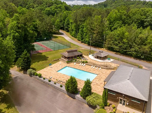 an aerial view of a house with outdoor space