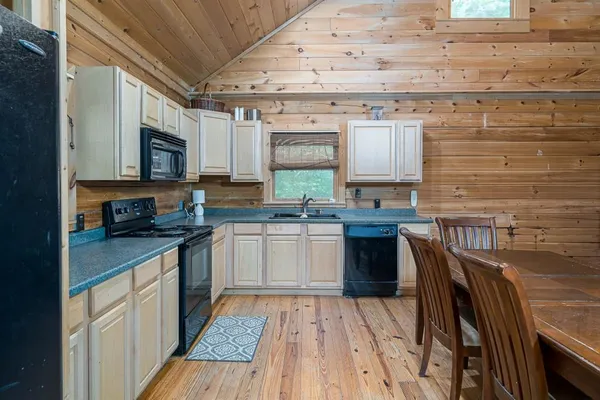 a kitchen with granite countertop lots of counter top space and stainless steel appliances