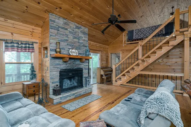 a living room with furniture windows and a fireplace