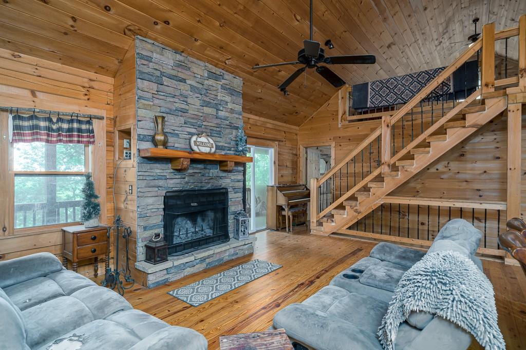 124 Adair Drive Ranger, GA 30734 - Photo 10 of 25 a living room with furniture windows and a fireplace