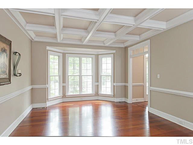 1013 Quiet Ridge Circle Raleigh, NC 27614 - Photo 4 of 15 a view of an empty room with wooden floor and a window