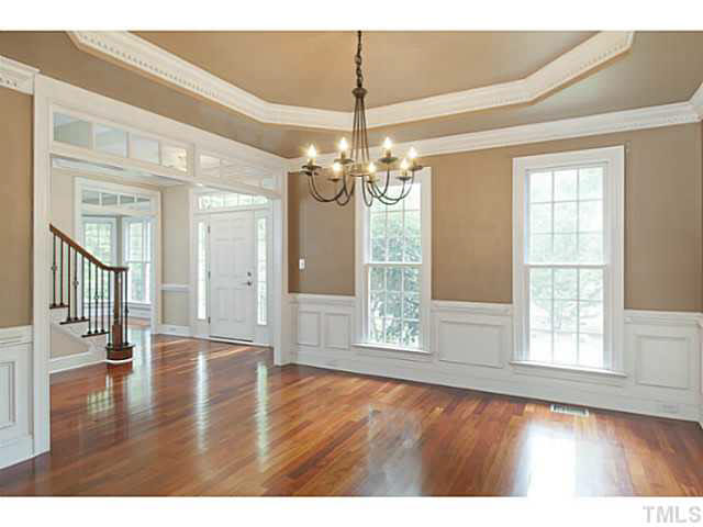 1013 Quiet Ridge Circle Raleigh, NC 27614 - Photo 5 of 15 a view of an empty room with wooden floor and a window