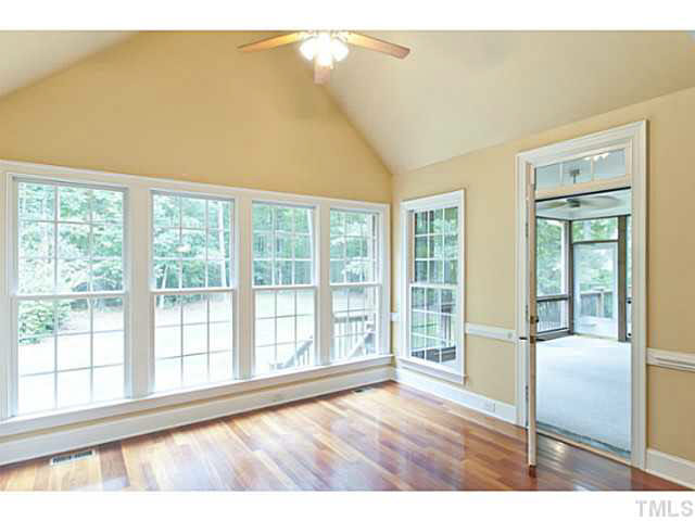 1013 Quiet Ridge Circle Raleigh, NC 27614 - Photo 7 of 15 a view of an empty room with wooden floor and a window