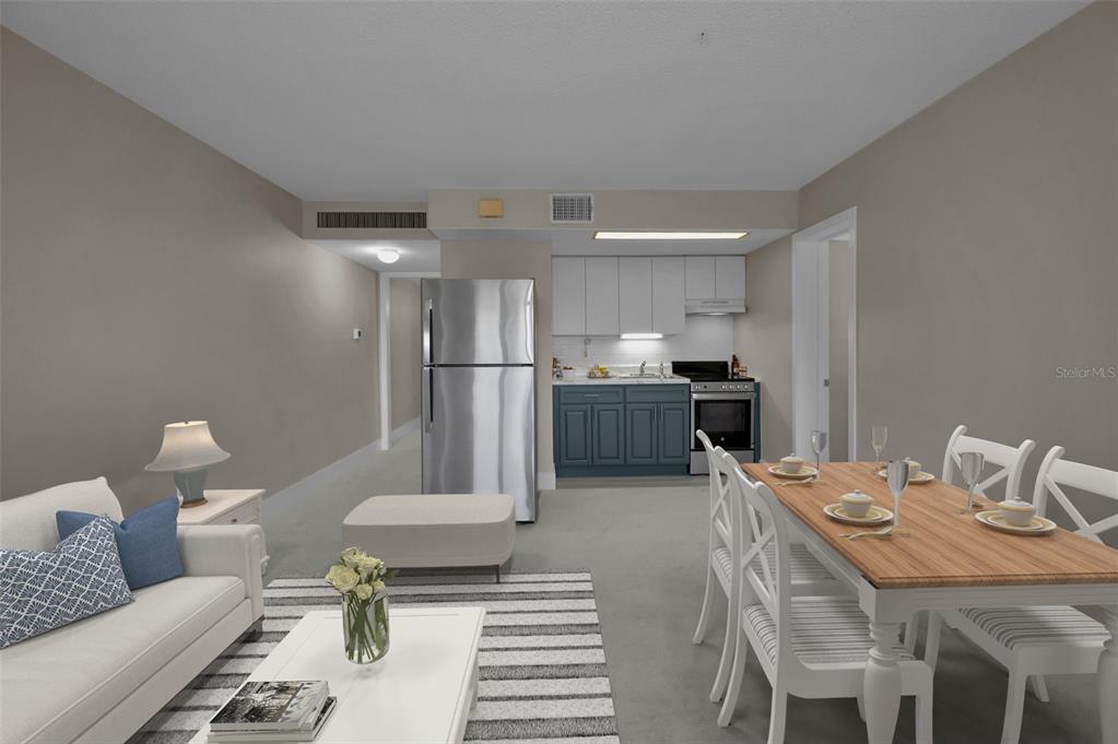 622 Edgewater Drive, Unit 123 Dunedin, FL 34698 - Photo 12 of 46 a living room with stainless steel appliances furniture a rug and a kitchen view