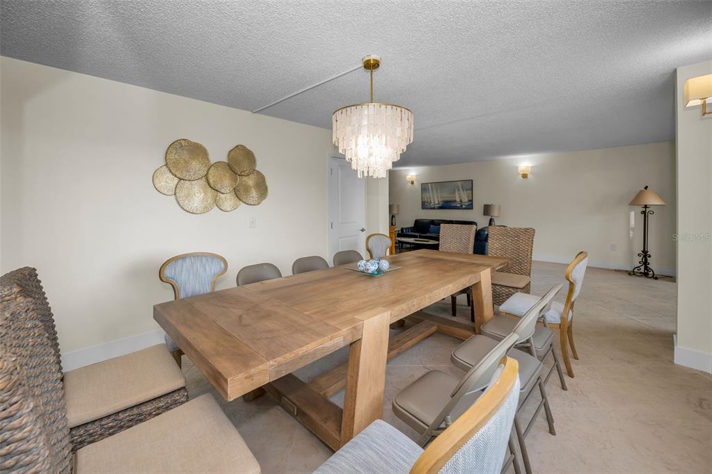 622 Edgewater Drive, Unit 123 Dunedin, FL 34698 - Photo 30 of 46 a view of a dining room with furniture