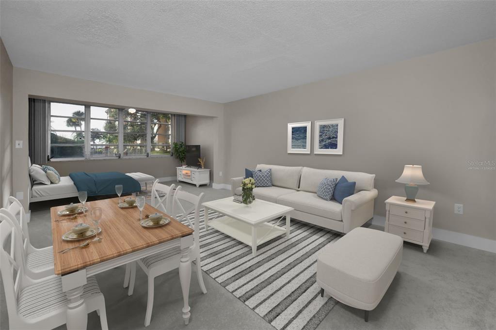 622 Edgewater Drive, Unit 123 Dunedin, FL 34698 - Photo 6 of 46 a living room with furniture and window