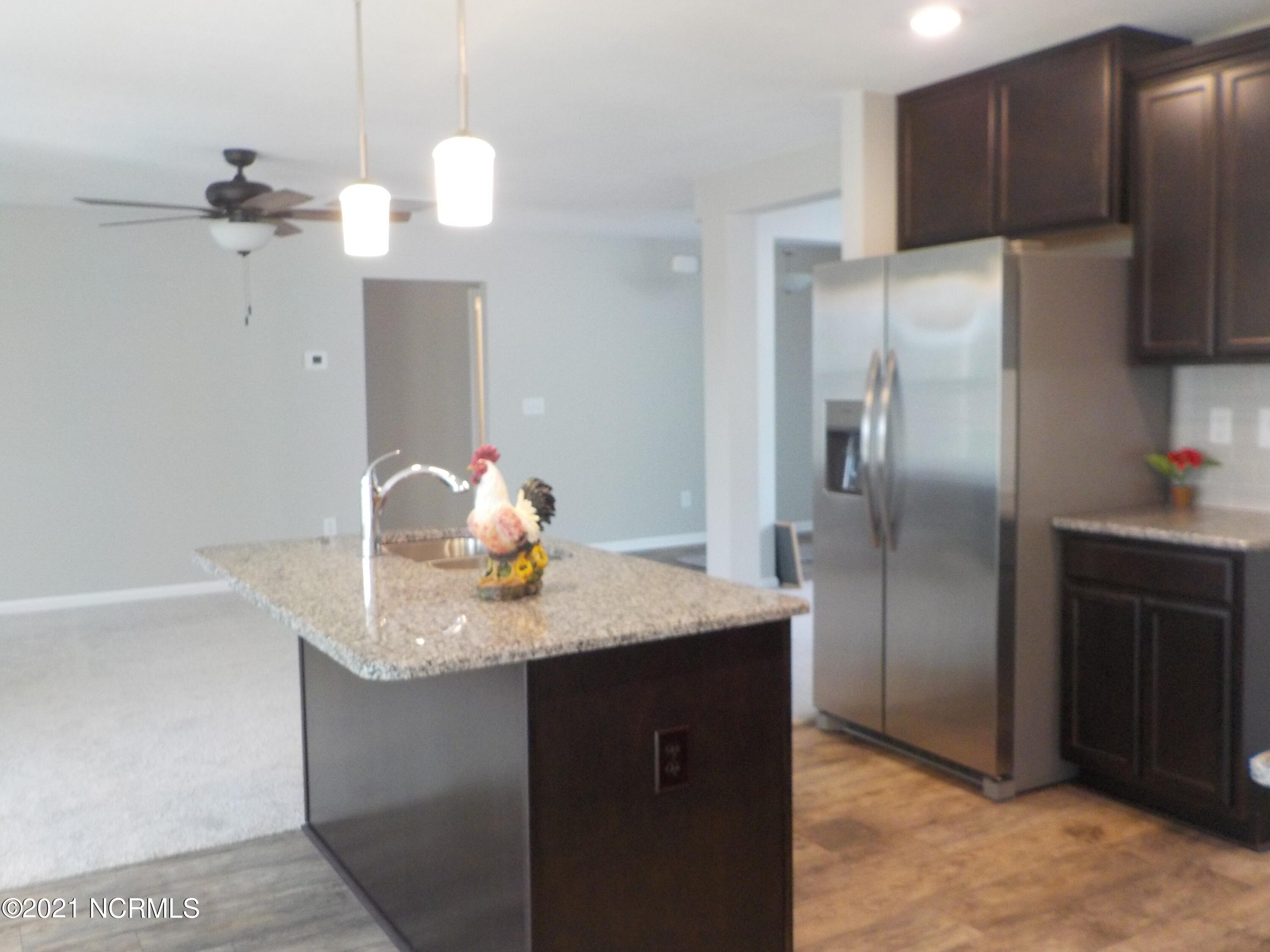 7735 Liles Road Bailey, NC 27807 - Photo 30 of 69 island with overhang, room for chairs