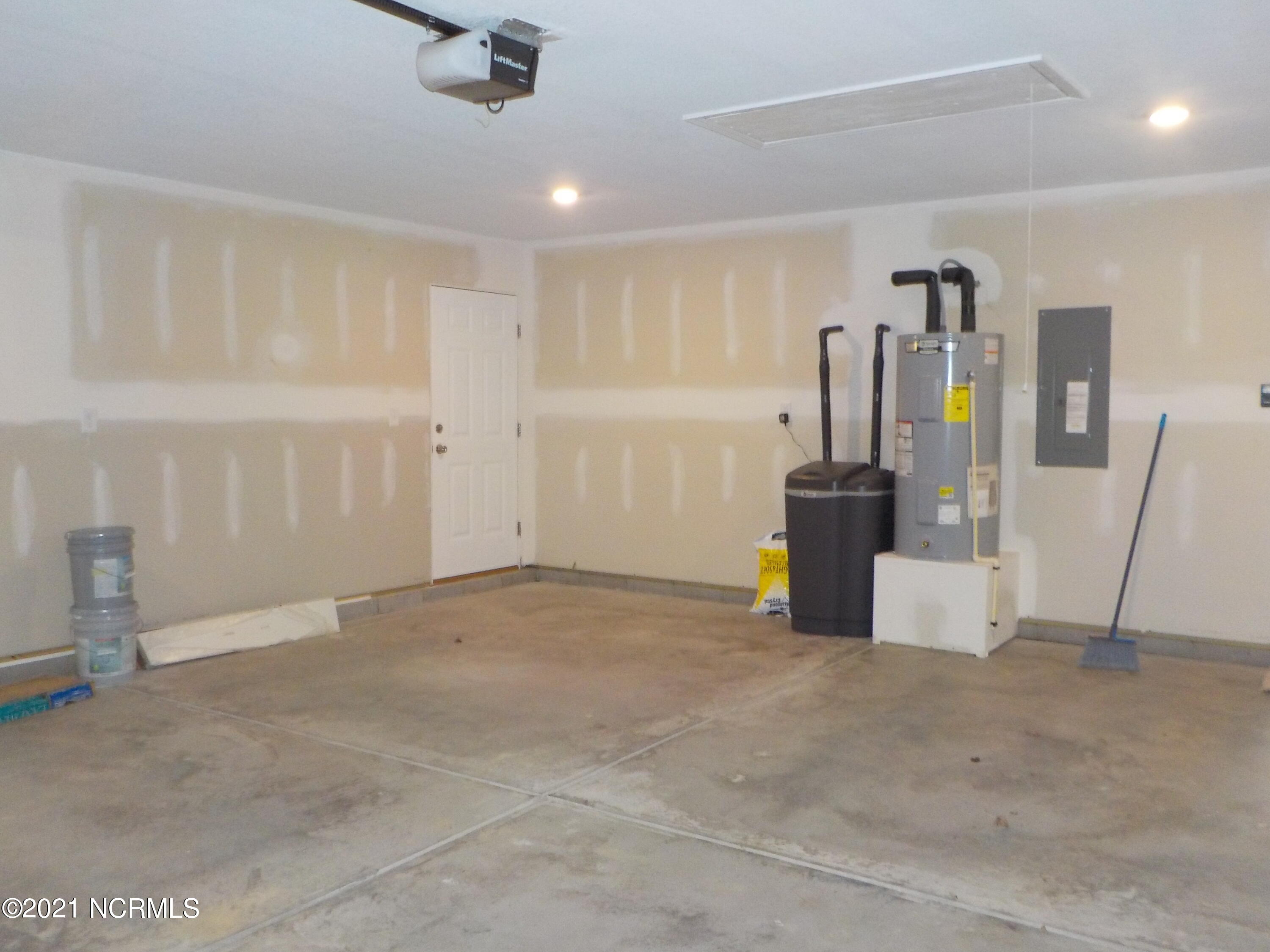 7735 Liles Road Bailey, NC 27807 - Photo 55 of 69 water heater and water softener in garage