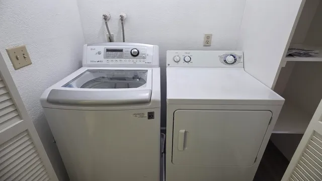 a utility room with dryer and washer