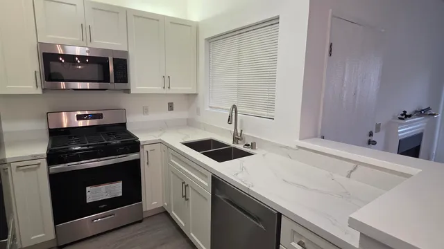 a kitchen with a stove and a microwave