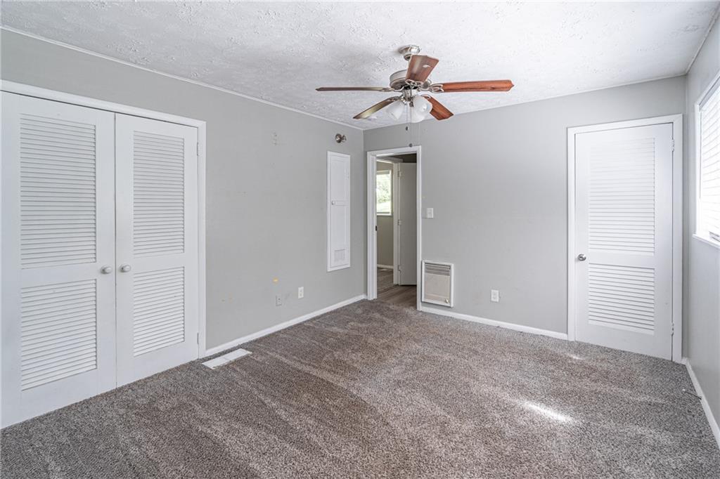 8035 Rockbridge Road Southwest Lithonia, GA 30058 - Photo 15 of 39 a view of empty room with a ceiling fan