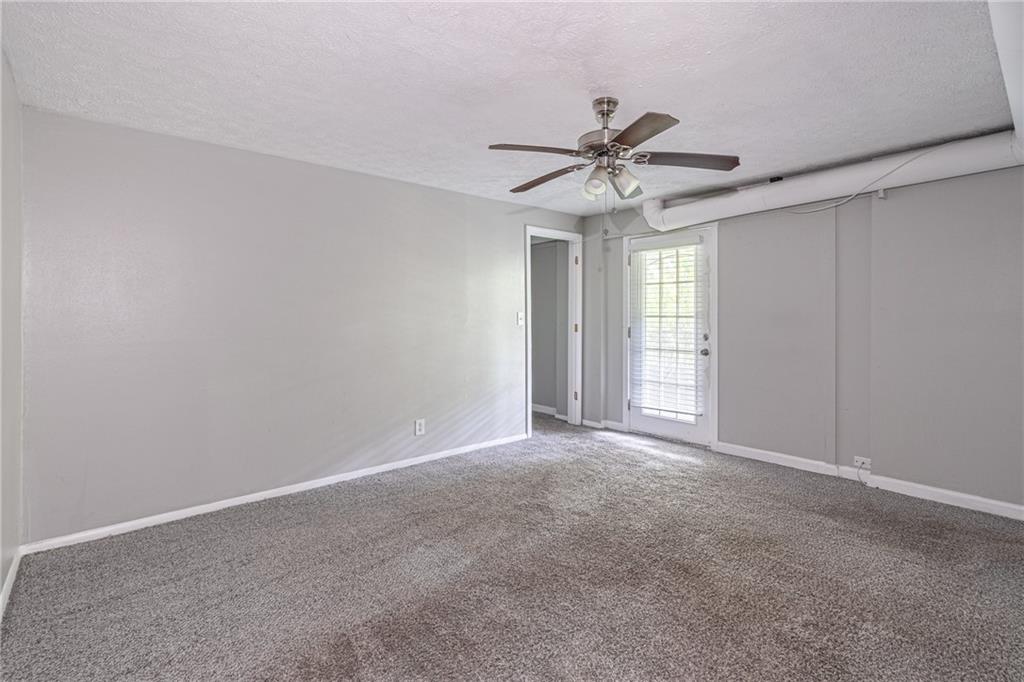 8035 Rockbridge Road Southwest Lithonia, GA 30058 - Photo 19 of 39 a view of an empty room with a window