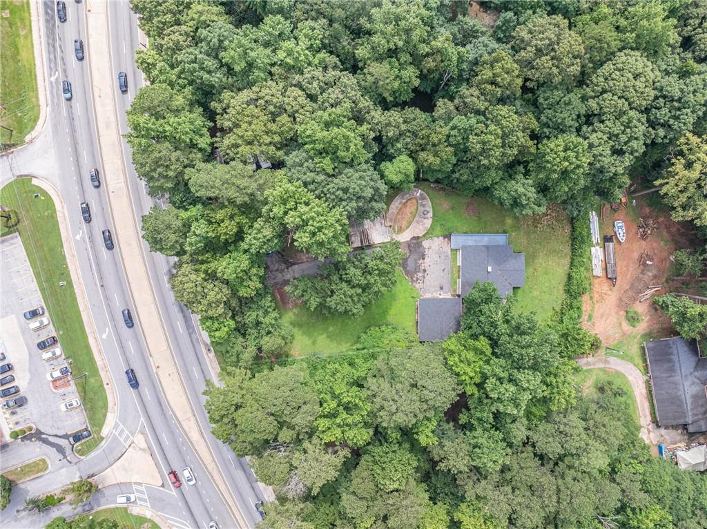8035 Rockbridge Road Southwest Lithonia, GA 30058 - Photo 30 of 39 an aerial view of a house with a yard