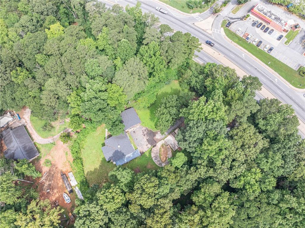 8035 Rockbridge Road Southwest Lithonia, GA 30058 - Photo 31 of 39 a aerial view of a house with a yard and fountain