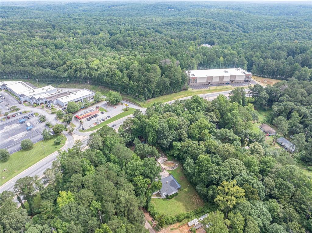 8035 Rockbridge Road Southwest Lithonia, GA 30058 - Photo 34 of 39 an aerial view of a house with a yard