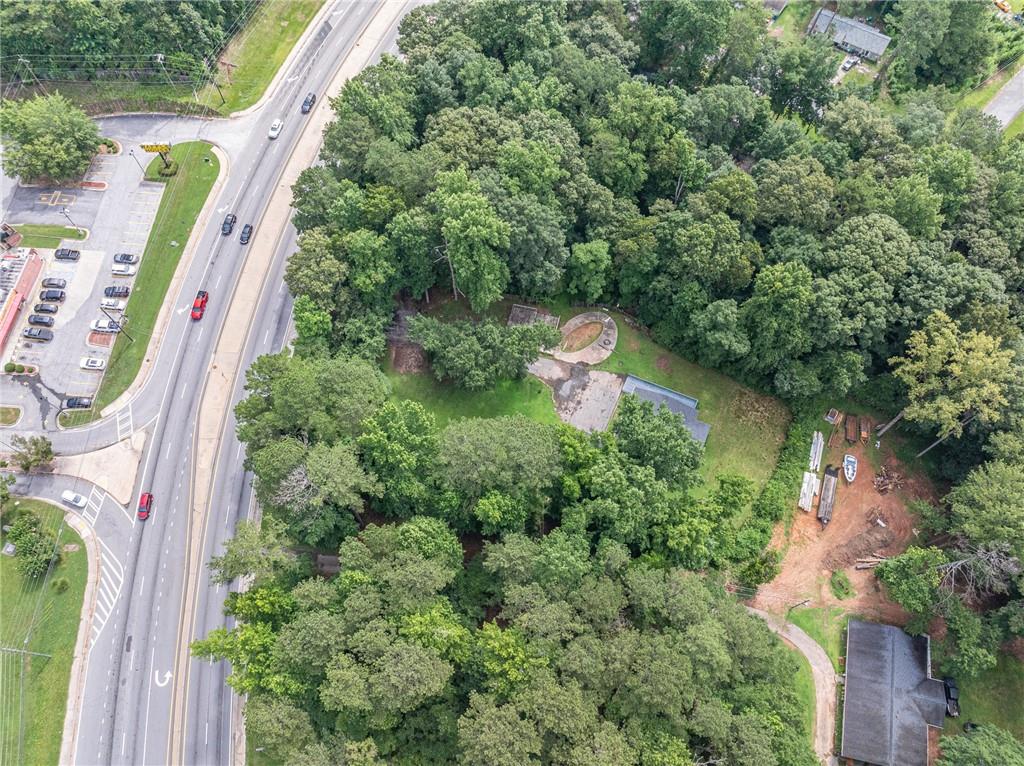 8035 Rockbridge Road Southwest Lithonia, GA 30058 - Photo 36 of 39 an aerial view of a house with outdoor space and street view