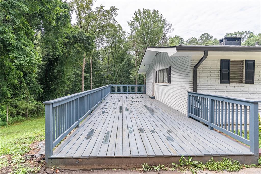 8035 Rockbridge Road Southwest Lithonia, GA 30058 - Photo 5 of 39 a view of wooden deck