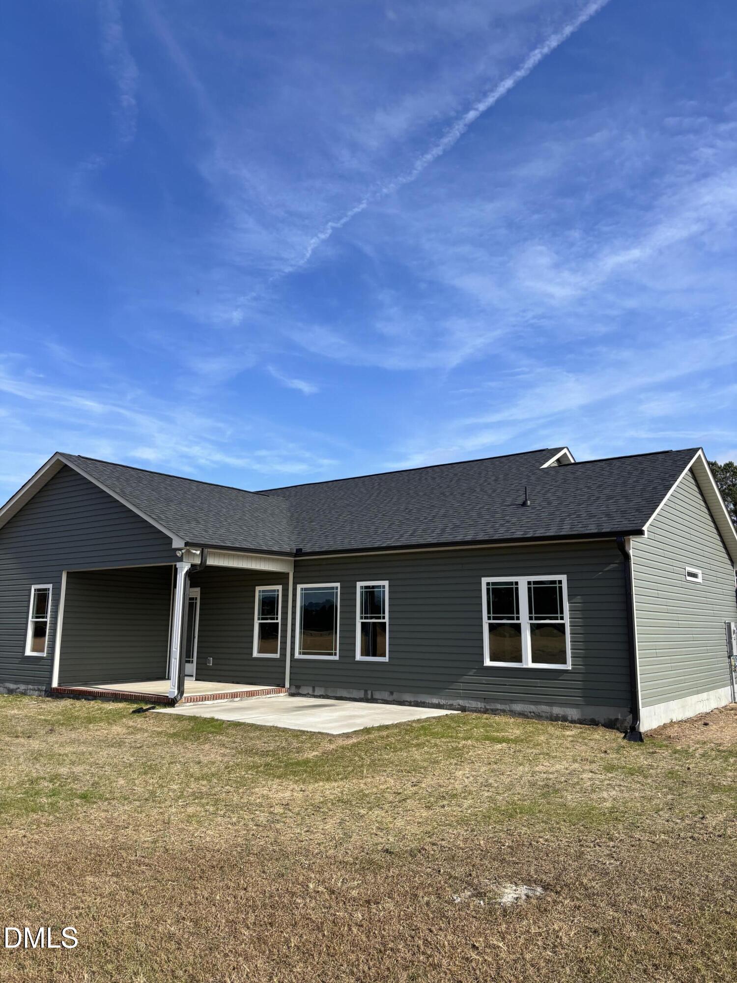 149 Budd Godwin Lane Dunn, NC 28334 - Photo 2 of 19 front view of a house with a yard