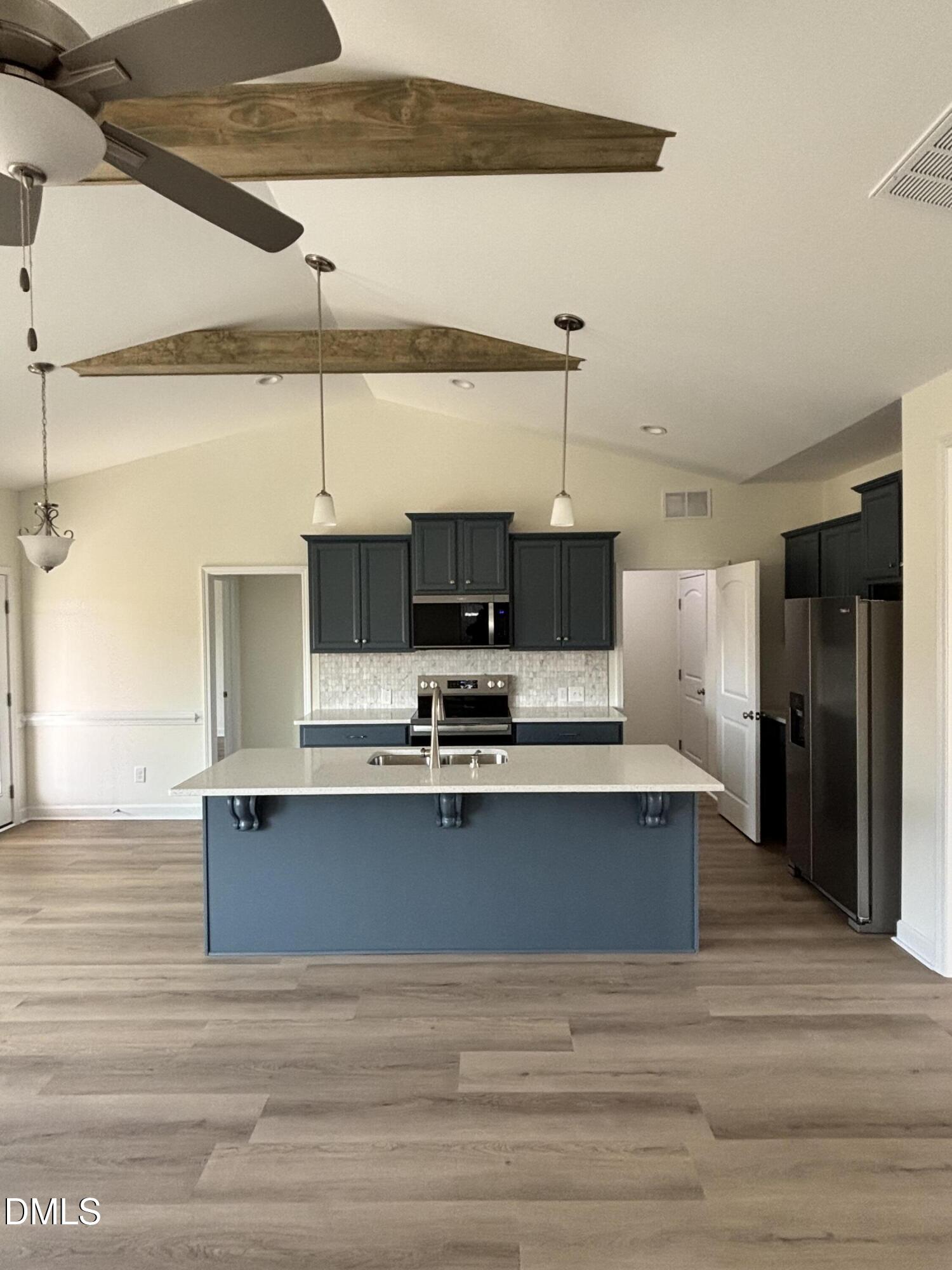 149 Budd Godwin Lane Dunn, NC 28334 - Photo 9 of 19 a view of kitchen with stainless steel appliances wooden floor
