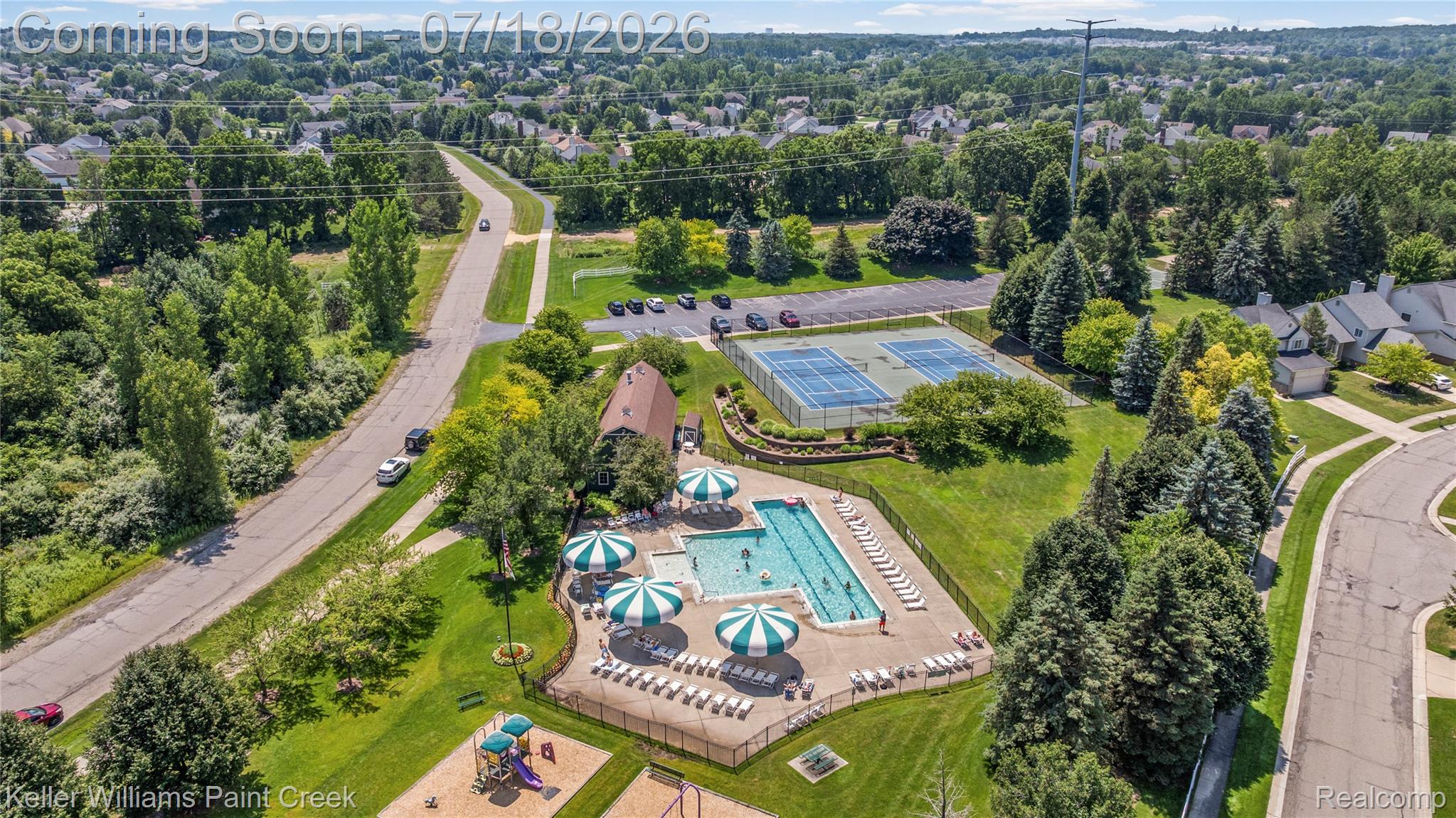 4230 Holly Lane Rochester, MI 48306 - Photo 60 of 64 Community amenities featuring an outdoor swimming pool, tennis courts, and a dedicated play area