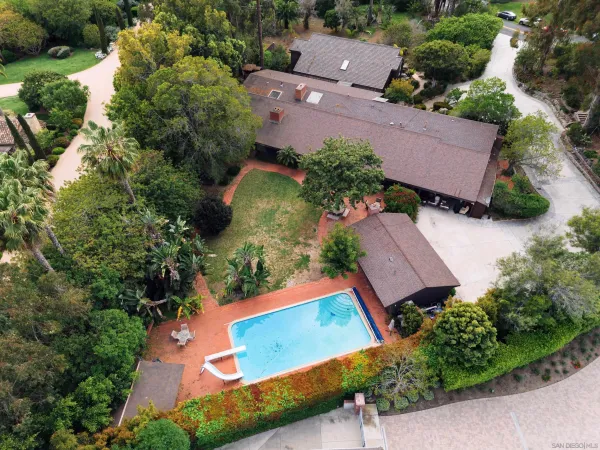 an aerial view of a house with a garden