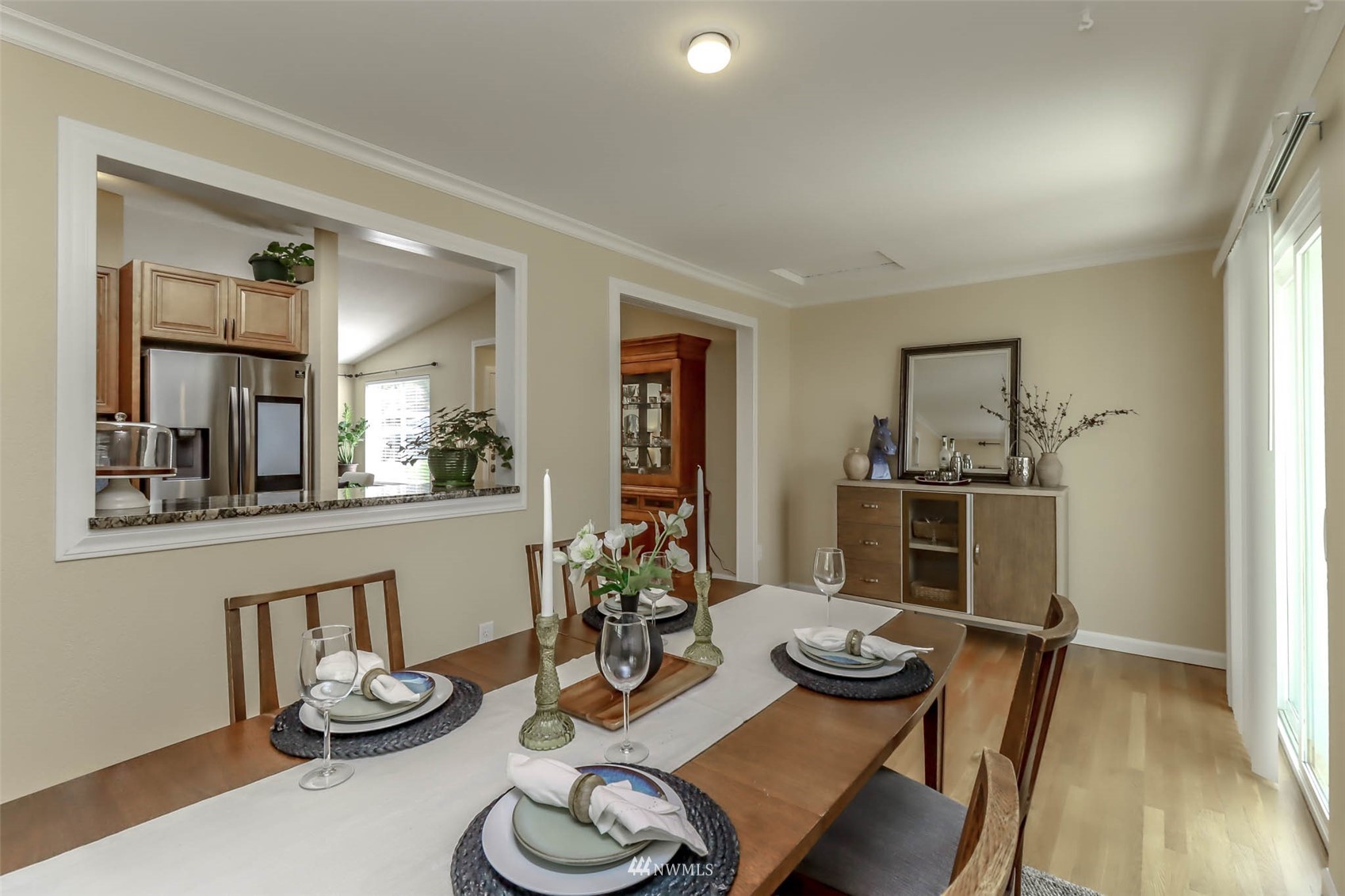 2221 182nd Street Southeast Bothell, WA 98012 - Photo 5 of 39 a view of a dining room with furniture and wooden floor