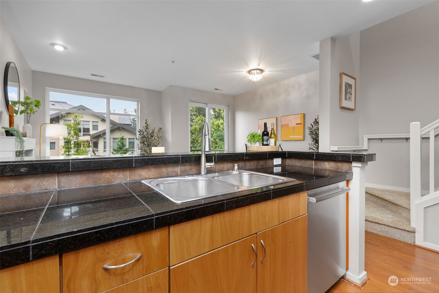 58 Cougar Ridge Road Northwest, Unit 2203 Issaquah, WA 98027 - Photo 11 of 37 a kitchen with a sink and a large window