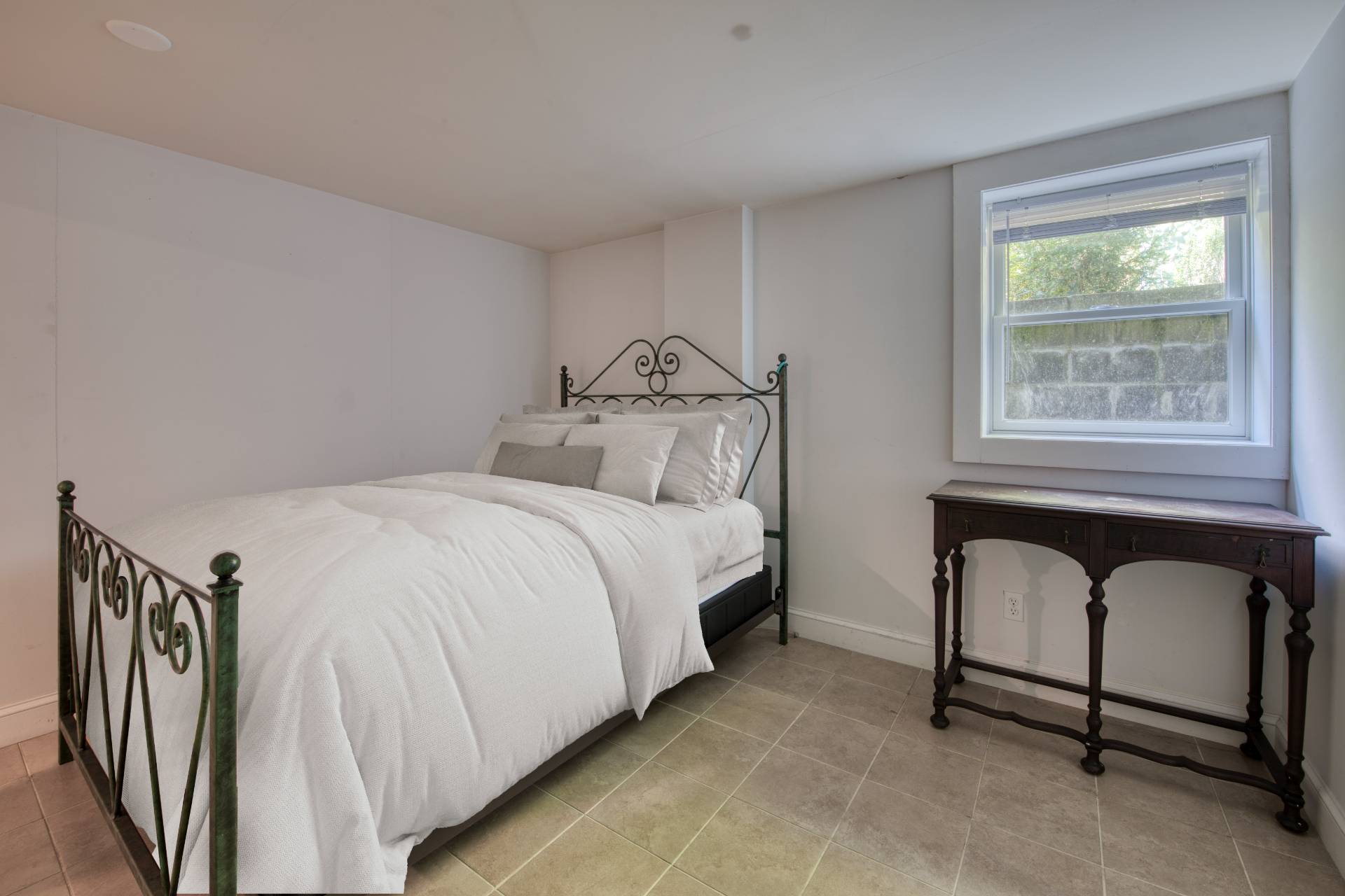 1 Abigails Path East Hampton, NY 11937 - Photo 12 of 18 a bedroom with a bed and a window
